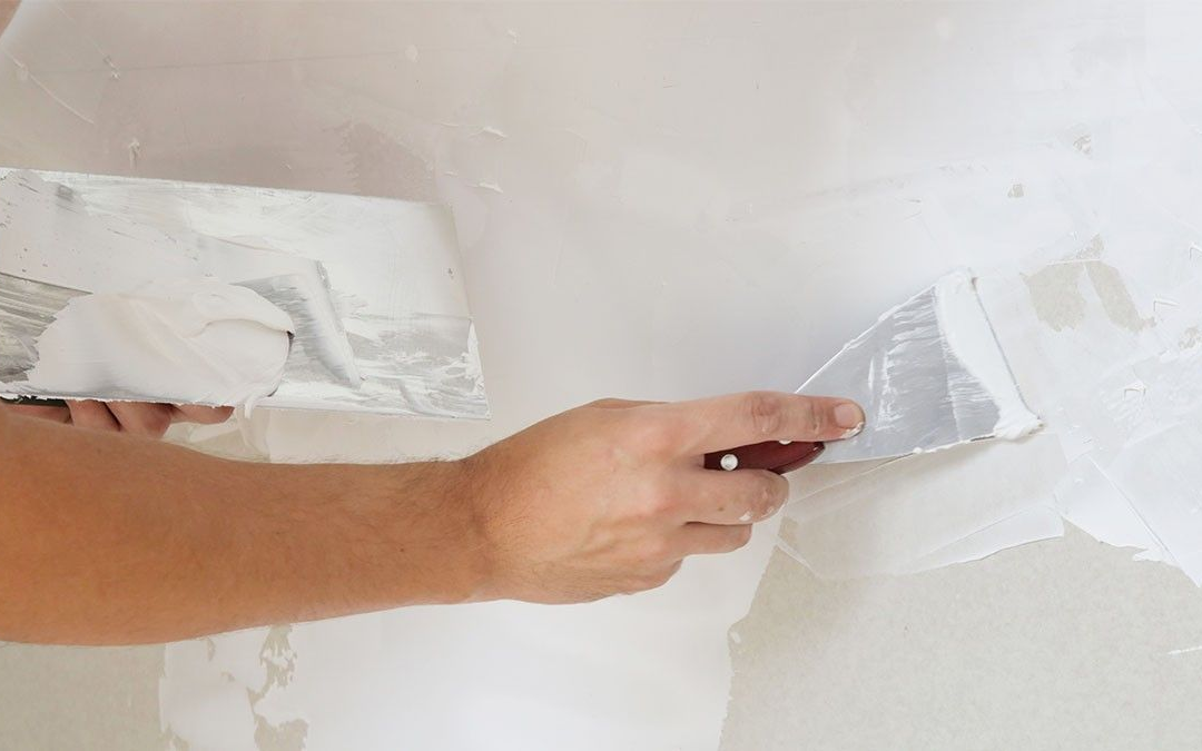 Charlotte Painting Pros expertly repairing and painting over drywall damage in Charlotte, NC