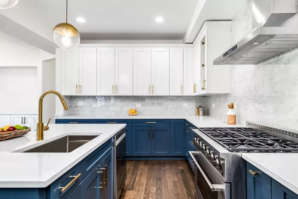 Experienced painter using specialized sprayer for even cabinet finish in Mount Holly, NC remodel