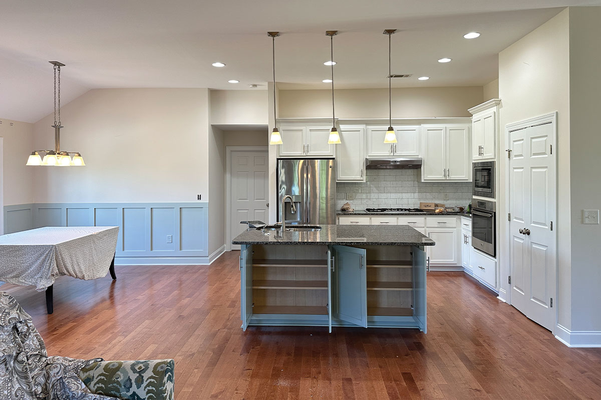Certified cabinet painting by Charlotte Painting Pros bringing new life to an outdated kitchen in Charlotte, NC