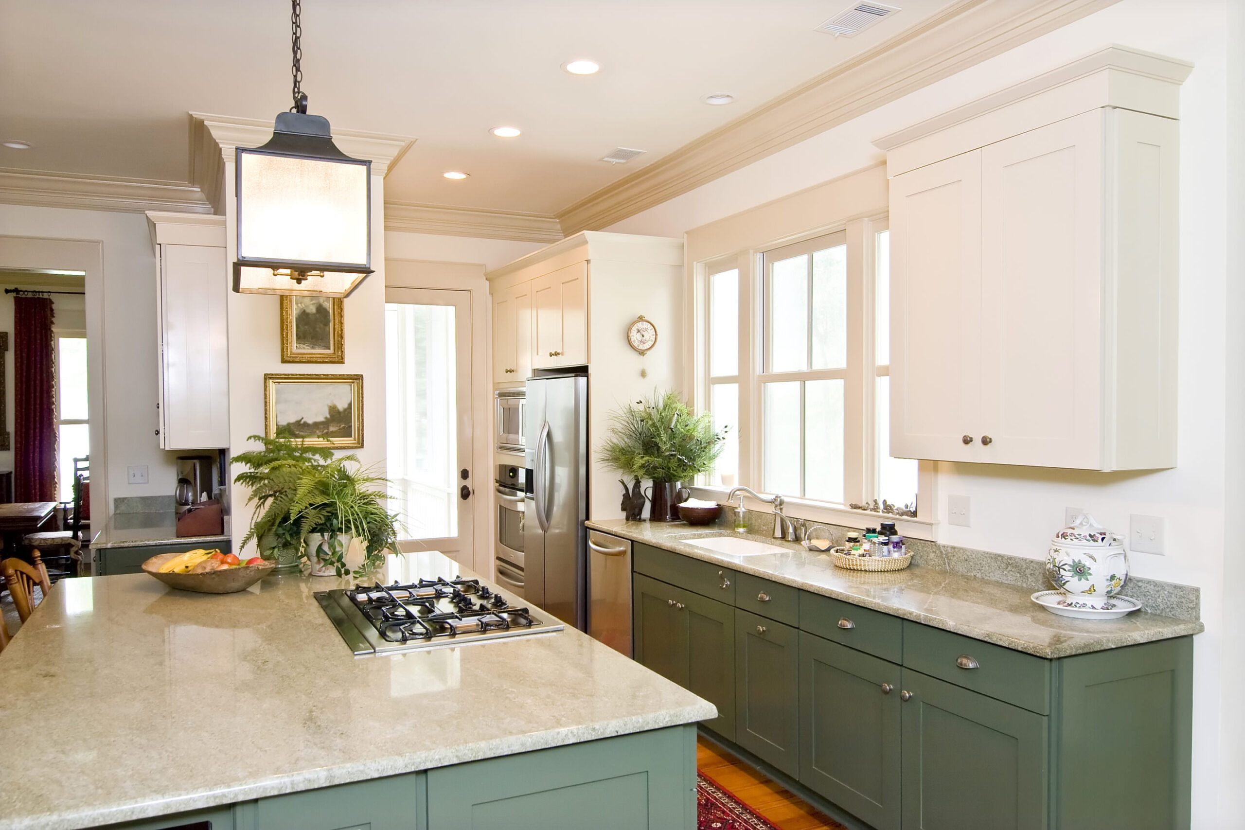 Painter applying expert brushwork to kitchen cabinet doors in a McAdenville, NC home for a flawless finish